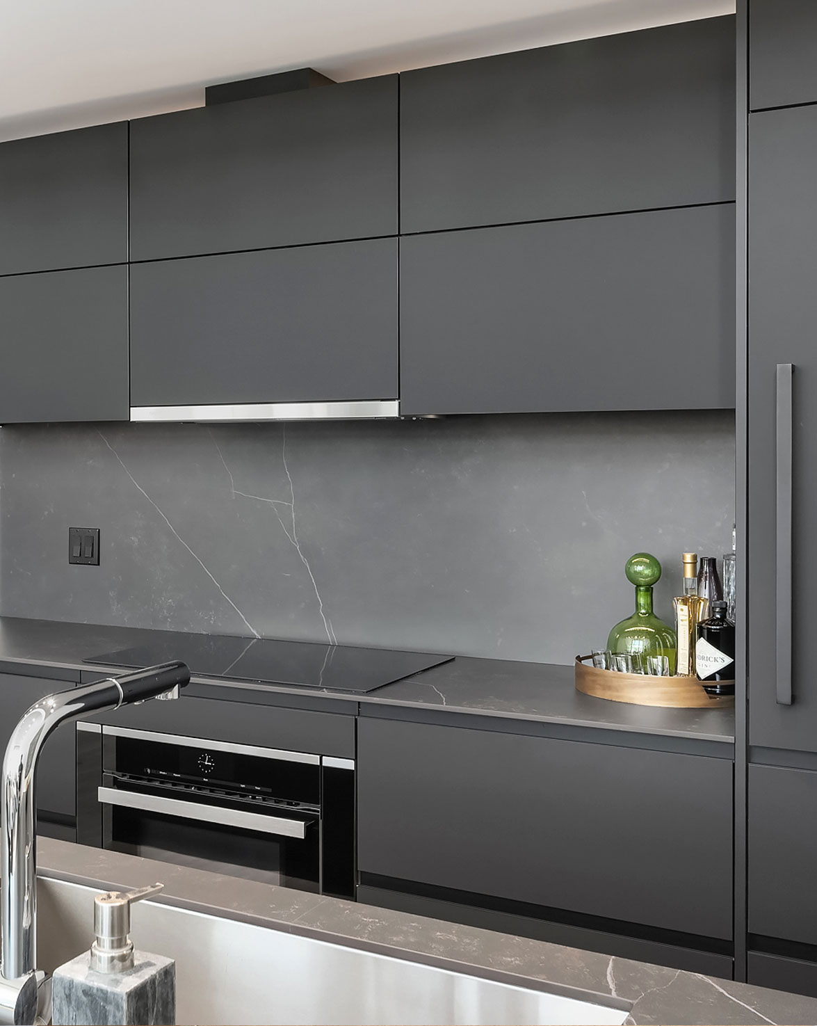 Modern kitchen with dark gray cabinets